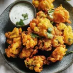 Irresistible Spiced Pakoras with Creamy Coconut Raita 8 Spiced Pakoras with Coconut Raita
